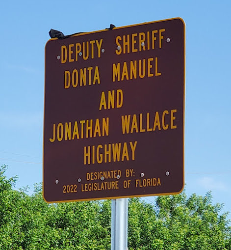 A portion of SR 715 has been renamed to honor Deputy Sheriff Donta Manuel and Jonathan Wallace. [Courtesy photo]